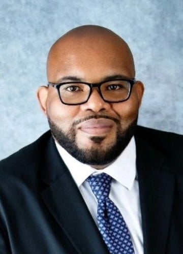 Headshot of Arron Gregory.