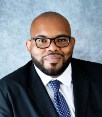 Headshot of Arron Gregory.