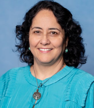 Headshot of Renu Kumar.
