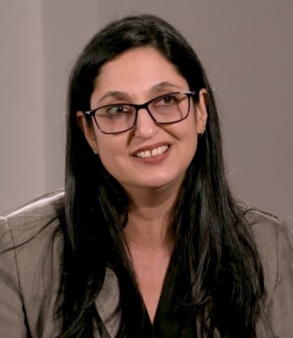 Headshot of Rima Brusi.